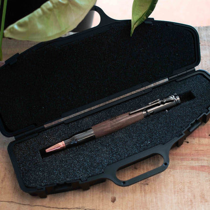 Autumn Woods Black Walnut Bolt Action Pen resting inside the Hard Black Pen Case